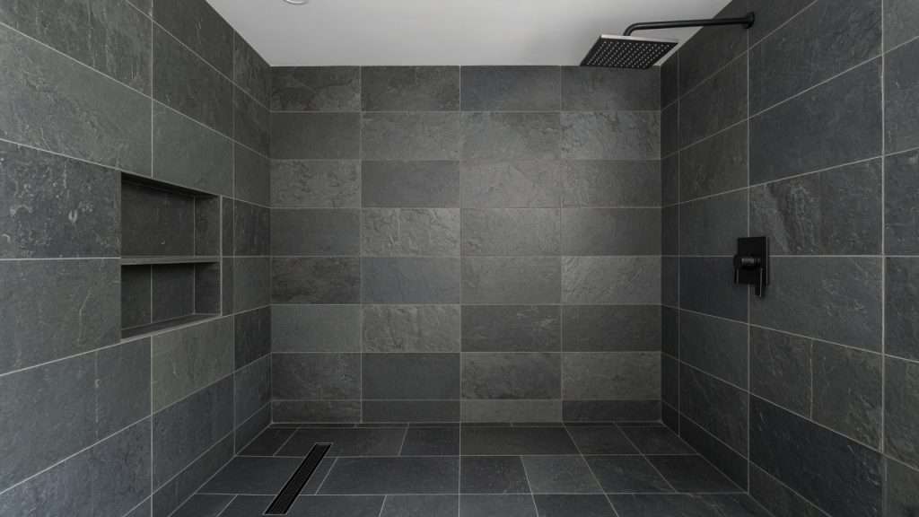Clean slate tile shower in San Diego