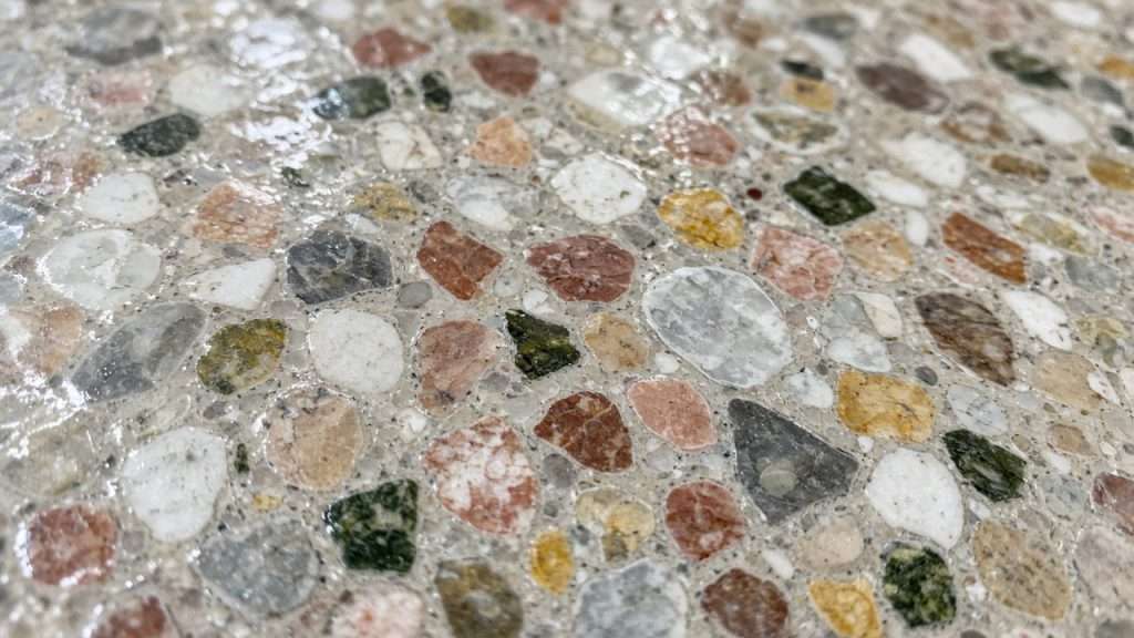 Close-up of polished terrazzo with colorful stone chips